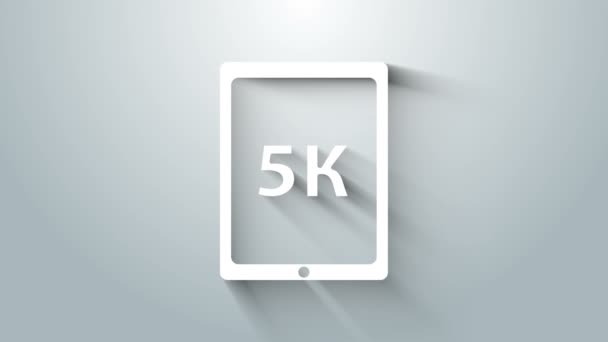 Hvid tablet med tekst 5k ikon isoleret på grå baggrund. 4K Video bevægelse grafisk animation – Stock-video