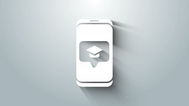 White Graduation cap on screen smartphone icon isolated on grey background. Online learning or e-learning concept. 4K Video motion graphic animation — Stock Video