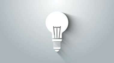 Gri arkaplanda fikir ikonu kavramına sahip beyaz ampul. Enerji ve fikir sembolü. İlham konsepti. 4K Video hareketli grafik canlandırması