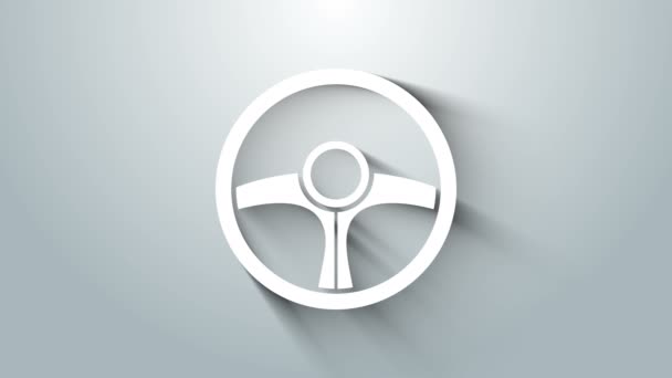 Біла піктограма керма ізольована на сірому фоні. Значок колеса автомобіля. 4K Відео рух графічна анімація — стокове відео