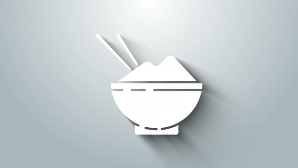 Witte rijst in een kom met eetstokpictogram geïsoleerd op grijze achtergrond. Traditioneel Aziatisch eten. 4K Video motion grafische animatie — Stockvideo
