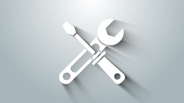 Vit skruvmejsel och skiftnyckel verktyg ikon isolerad på grå bakgrund. Tjänsteverktygets symbol. 4K Video motion grafisk animation — Stockvideo