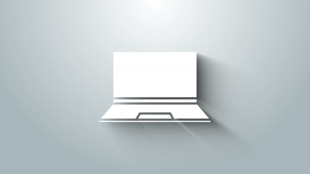 グレーの背景に隔離されたホワイトノートパソコンのアイコン。空の画面表示のコンピュータノートブック。4Kビデオモーショングラフィックアニメーション — ストック動画