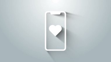 Gri arka planda kalp ikonu olan beyaz cep telefonu. Sevgililer Günü. 4K Video hareketli grafik canlandırması