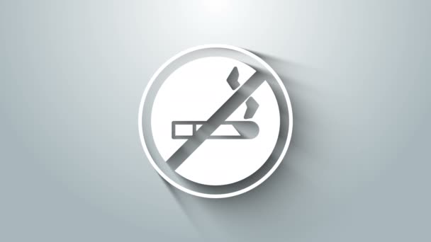 Белый значок "Курить запрещено" на сером фоне. Символ сигарет. Видеографическая анимация 4K — стоковое видео