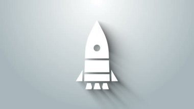 Beyaz Roket gemisi simgesi gri arkaplanda izole edildi. Uzay yolculuğu. 4K Video hareketli grafik canlandırması