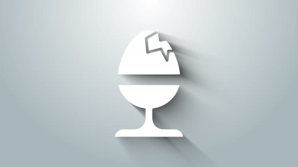 Huevo de pollo blanco en un icono de pie aislado sobre fondo gris. Feliz Pascua. Animación gráfica de vídeo 4K — Vídeo de stock