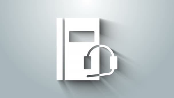 Icono de libro de audio blanco aislado sobre fondo gris. Reserva con auriculares. Signo de audio guía. Concepto de aprendizaje en línea. Animación gráfica de vídeo 4K — Vídeo de stock