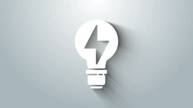 Gri arkaplanda ışık simgesi olan beyaz ampul. Lamba ışığı. Fikir sembolü. 4K Video hareketli grafik canlandırması