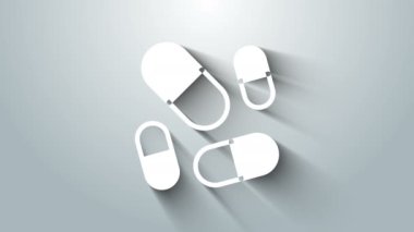 Beyaz vitamin kompleksi, gri arka planda izole edilmiş hap kapsülü ikonu. Sağlıklı bir yaşam tarzı. 4K Video hareketli grafik canlandırması