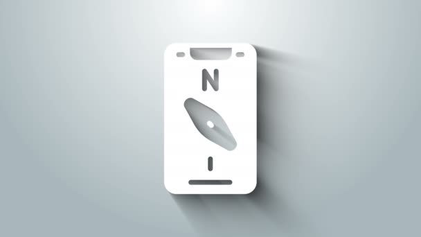 グレーの背景に隔離されたナビゲーションアイコンのためのスマートフォン上のホワイトコンパス画面アプリ。ナビゲーション、アプリマップのためのアプリケーションコンパス。4Kビデオモーショングラフィックアニメーション — ストック動画