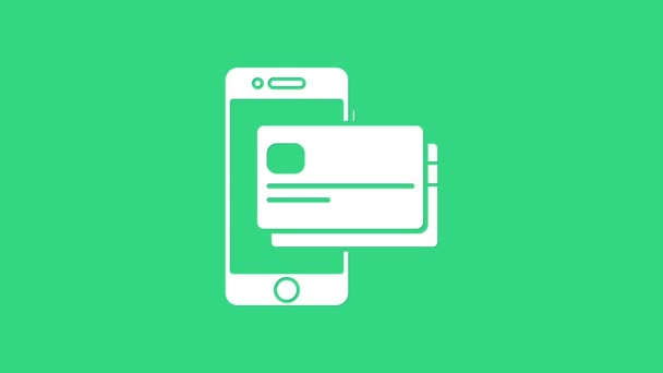 화이트 모바일 전화와 신용 카드 아이콘 녹색 배경에서 분리. 스마트폰 온라인 결제 개념. NFC 가 지불 한다. 전송 아이콘. 4K 비디오 모션 그래픽 애니메이션 — 비디오