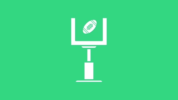 Poste de gol de fútbol americano blanco e ícono de pelota de fútbol aislado sobre fondo verde. Animación gráfica de vídeo 4K — Vídeo de stock