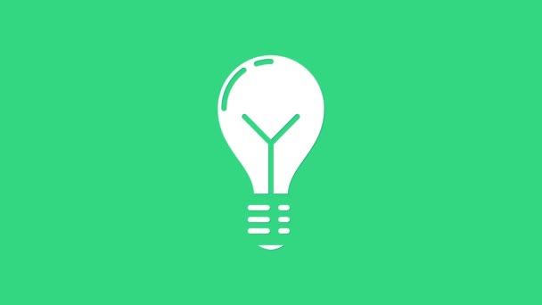 緑の背景にアイコンが隔離された白い電球。エネルギーとアイデアのシンボル。インスピレーションの概念。4Kビデオモーショングラフィックアニメーション — ストック動画