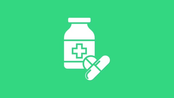 Beyaz ilaç şişesi ve yeşil arka planda izole edilmiş hap ikonu. Şişe hapı işareti. Eczane tasarımı. 4K Video hareketli grafik canlandırması — Stok video
