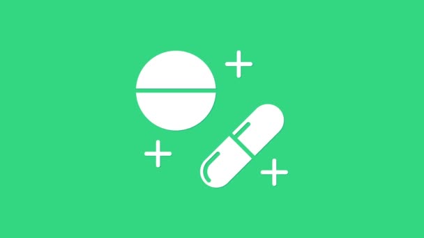 Λευκό χάπι φάρμακο ή δισκίο εικονίδιο απομονώνονται σε πράσινο φόντο. Χάπι καψακίου και σημάδι ναρκωτικών. Σχεδιασμός φαρμακείου. 4K Γραφική κίνηση κίνησης βίντεο — Αρχείο Βίντεο