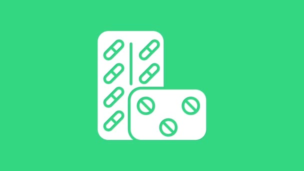 Λευκά χάπια σε συσκευασία κυψέλης που απομονώνονται σε πράσινο φόντο. Φαρμακευτικό πακέτο για ταμπλέτες, βιταμίνες, αντιβιοτικά, ασπιρίνες. 4K Γραφική κίνηση κίνησης βίντεο — Αρχείο Βίντεο
