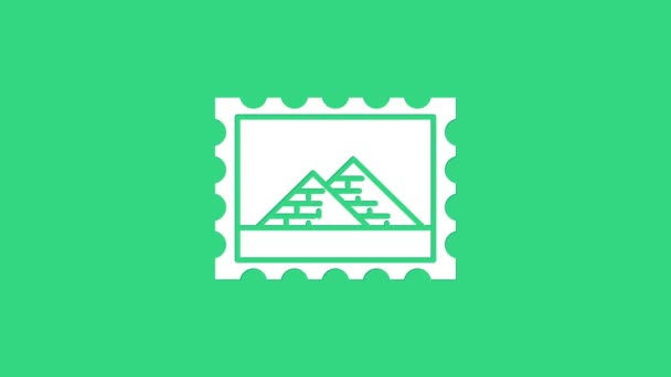 White Postal stamp and Egypt pyramids icon isolated on green background. 4K Video motion graphic animation — Stock Video