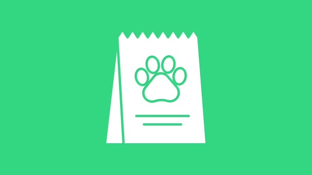 Saco branco de comida para o ícone do cão isolado no fundo verde. Impressão de pata de cão ou gato. Comida para animais. Pacote de alimentos para animais. Animação gráfica em movimento de vídeo 4K — Vídeo de Stock