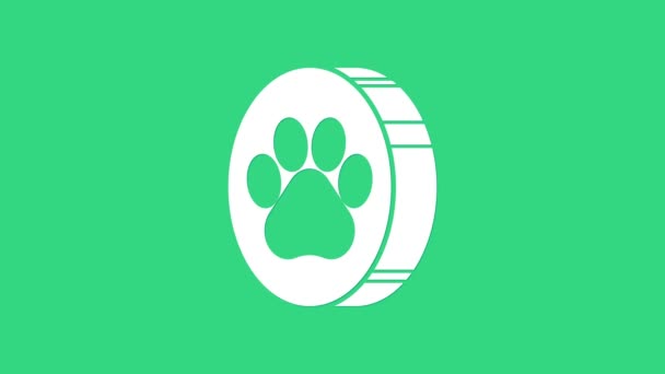 Белый значок печати лапы изолирован на зеленом фоне. Отпечаток лапы собаки или кошки. Животный след. Видеографическая анимация 4K — стоковое видео
