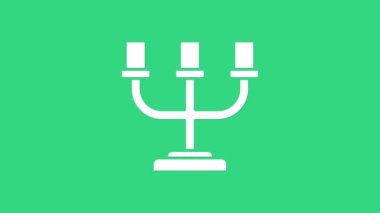 Beyaz şamdan simgesi yeşil arkaplanda izole edildi. 4K Video hareketli grafik canlandırması