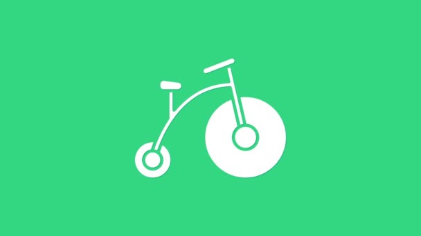 Белый винтажный велосипед с одним большим колесом и одним маленьким значком, выделенным на зеленом фоне. Велосипедный знак общественного транспорта. Видеографическая анимация 4K — стоковое видео