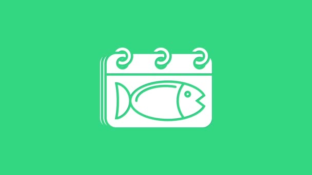 Calendario blanco con un icono de pescado aislado sobre fondo verde. Día de los peces. Animación gráfica de vídeo 4K — Vídeos de Stock