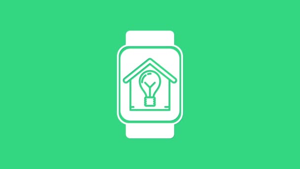 Orologio intelligente bianco con casa intelligente e icona lampadina isolata su sfondo verde. Animazione grafica 4K Video motion — Video Stock