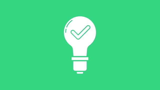 White Light bulb and check mark icon isolated on green background. Concept of idea. 4K Video motion graphic animation — Stock Video