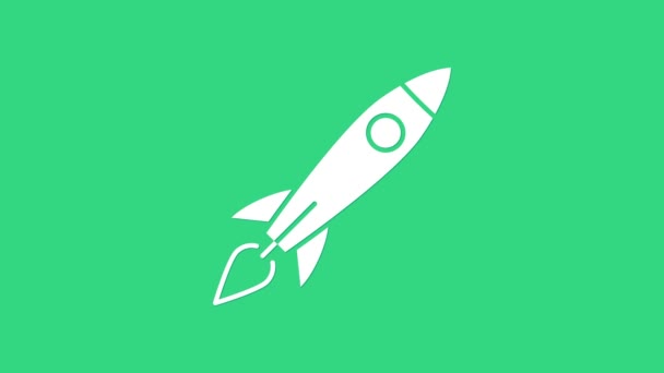 Cohete blanco con icono de fuego aislado sobre fondo verde. Viaje espacial. Animación gráfica de vídeo 4K — Vídeos de Stock