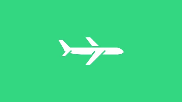 Белый плоскость значок изолирован на зеленом фоне. Икона летающего самолета. Вывеска авиалайнера. Видеографическая анимация 4K — стоковое видео