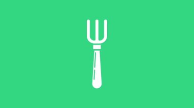 Beyaz Çatal simgesi yeşil arkaplanda izole edildi. Çatal bıçak sembolü. 4K Video hareketli grafik canlandırması