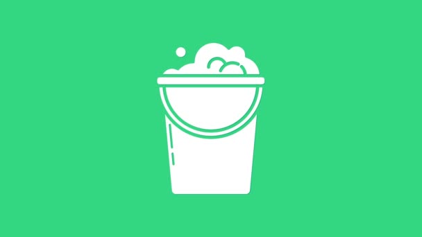 White Bucket with foam and bubbles icon isolated on green background. Cleaning service concept. 4K Video motion graphic animation — Stock Video
