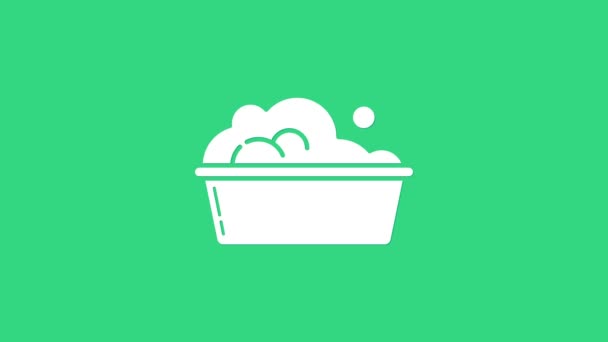 White Plastic basin with soap suds icon isolated on green background. Bowl with water. Washing clothes, cleaning equipment. 4K Video motion graphic animation — Stock Video