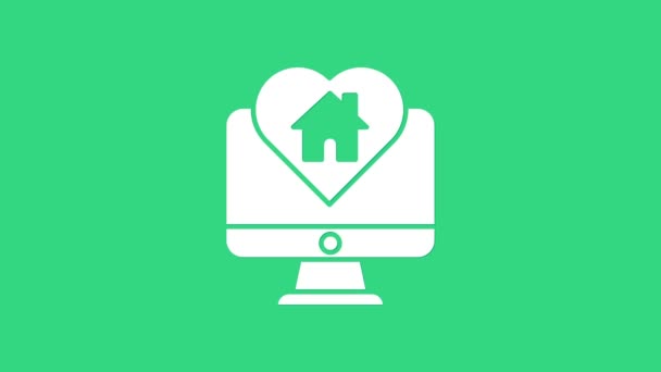 Monitor komputer putih dengan bentuk rumah dalam bentuk hati ikon terisolasi pada latar belakang hijau. Cinta simbol rumah. Keluarga, real estate dan realty. Animasi grafis gerak Video 4K — Stok Video