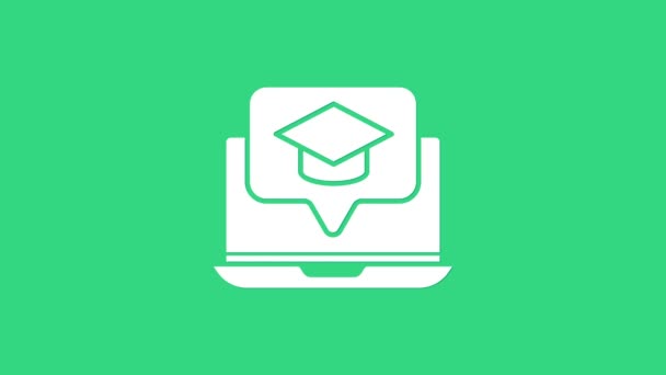 Bílá Graduation čepice na obrazovce notebook ikony izolované na zeleném pozadí. Online učení nebo e-learning koncept. Grafická animace pohybu videa 4K