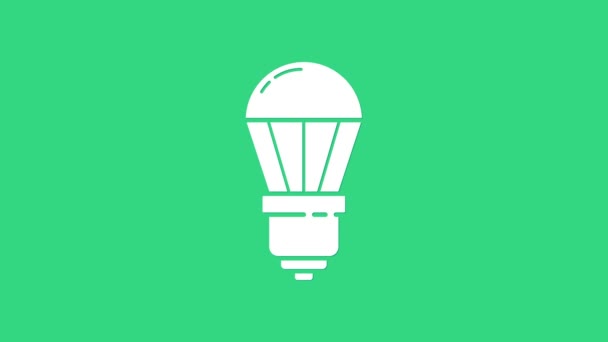 緑色の背景に分離された白色LED電球アイコン。経済的なLED照明電球。エネルギーランプを節約。4Kビデオモーショングラフィックアニメーション — ストック動画