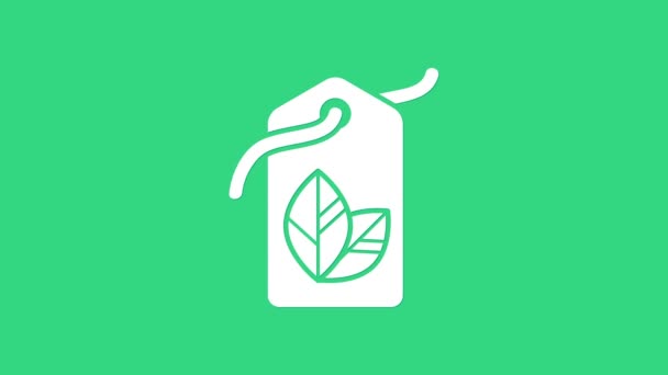 Λευκή ετικέτα με φύλλο σύμβολο εικονίδιο απομονώνονται σε πράσινο φόντο. Banner, label, tag, logo, αυτοκόλλητο για eco green. 4K Γραφική κίνηση κίνησης βίντεο — Αρχείο Βίντεο