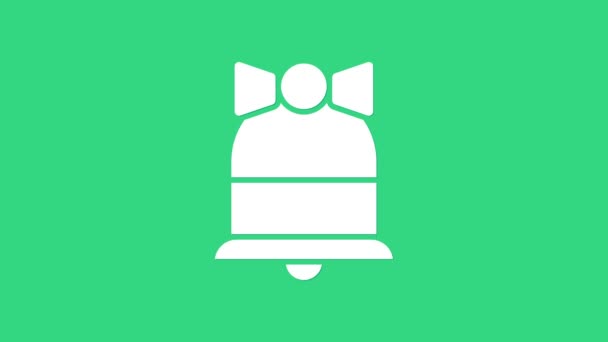 緑の背景に隔離されたホワイトメリークリスマスリンギングベルアイコン。アラーム記号、サービスベル、ハンドベル記号、通知記号。4Kビデオモーショングラフィックアニメーション — ストック動画