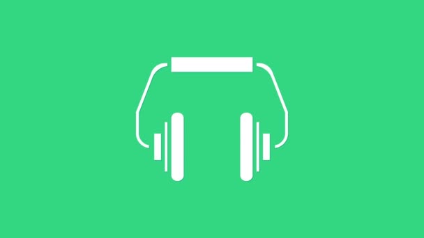 Weißes Kopfhörersymbol isoliert auf grünem Hintergrund. Kopfhörer. Konzept zum Hören von Musik, Service, Kommunikation und Bedienung. 4K Video Motion Grafik Animation — Stockvideo