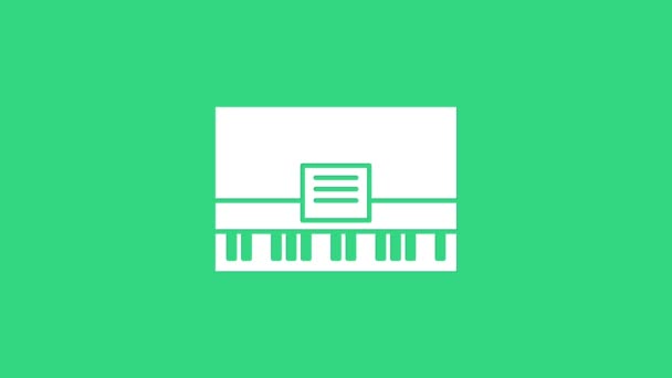 Weißes Piano-Symbol isoliert auf grünem Hintergrund. Musikinstrument. 4K Video Motion Grafik Animation — Stockvideo