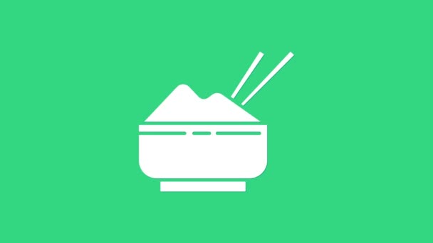 Белый рис в миске с иконкой палочки для еды изолирован на зеленом фоне. Традиционная азиатская кухня. Видеографическая анимация 4K — стоковое видео