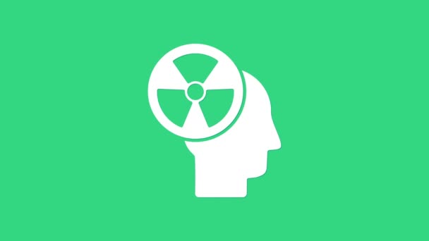 Silueta blanca de una cabeza humana y un icono de símbolo de radiación aislado sobre fondo verde. Animación gráfica de vídeo 4K — Vídeos de Stock