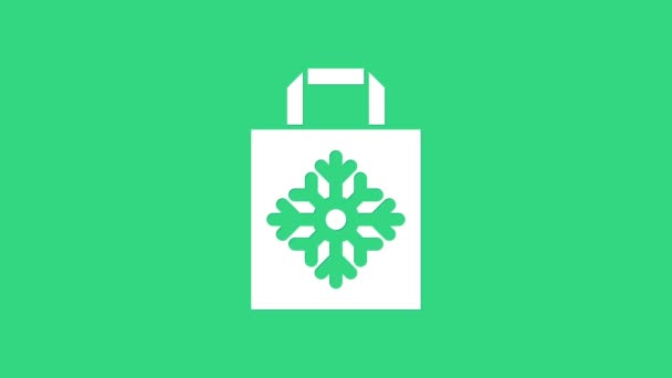 White Christmas paper shopping bag icon isolated on green background. Package sign. Merry Christmas and Happy New Year. 4K Video motion graphic animation — Stock Video