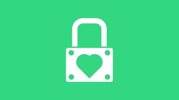 緑の背景に隔離されたホワイトロックとハートアイコン。心をロックした。愛のシンボルと鍵穴の標識。バレンタインデーのシンボル。4Kビデオモーショングラフィックアニメーション — ストック動画
