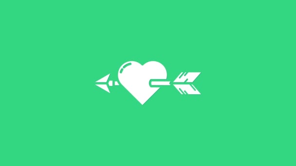 Hvitt Amour-symbol med isolert hjerte og pilikon på grønn bakgrunn. Kjærlighetsskilt. Valentinessymbol. 4K Video motion grafisk animasjon – stockvideo