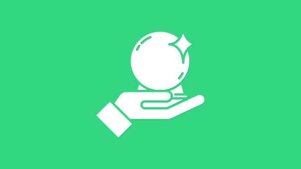 Fehér mágikus labda kéznél ikon elszigetelt zöld háttérrel. Kristálygömb. 4K Videó mozgás grafikus animáció — Stock videók