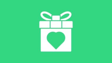 Beyaz hediye kutusu ve kalp ikonu yeşil arka planda izole edilmiş. 8 Mart. Uluslararası Mutlu Kadınlar Günü. 4K Video hareketli grafik canlandırması