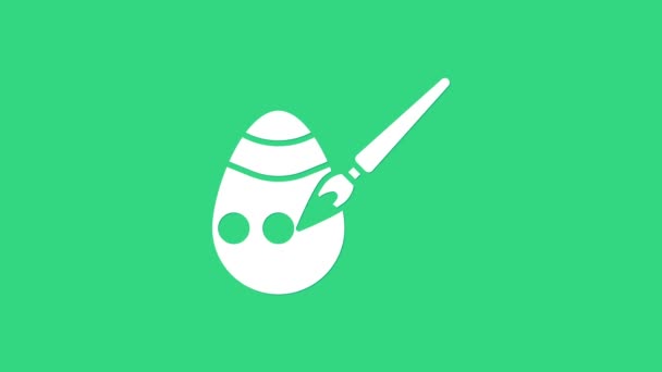 白イースターの卵と緑の背景に隔離されたブラシアイコンをペイント。ハッピーイースター。4Kビデオモーショングラフィックアニメーション — ストック動画