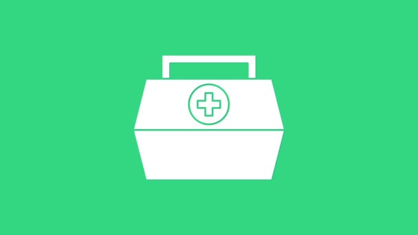 Vit Första hjälpen kit ikon isolerad på grön bakgrund. Medicinsk låda med kors. Medicinsk utrustning för nödsituationer. Sjukvårdskoncept. 4K Video motion grafisk animation — Stockvideo